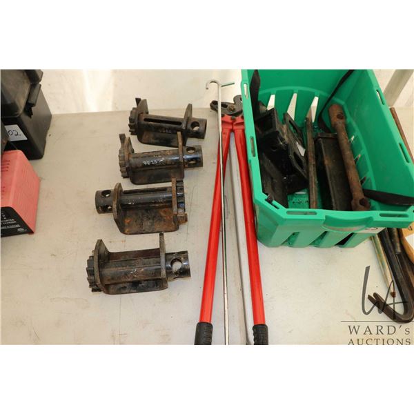 Four strap ratchets, trailer hitch components, kingpin hook, tire chains, pliers etc.