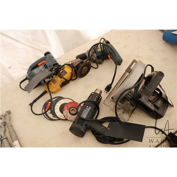 Selection of corded hand tools including circular saw, heat gun, angle grinder etc.