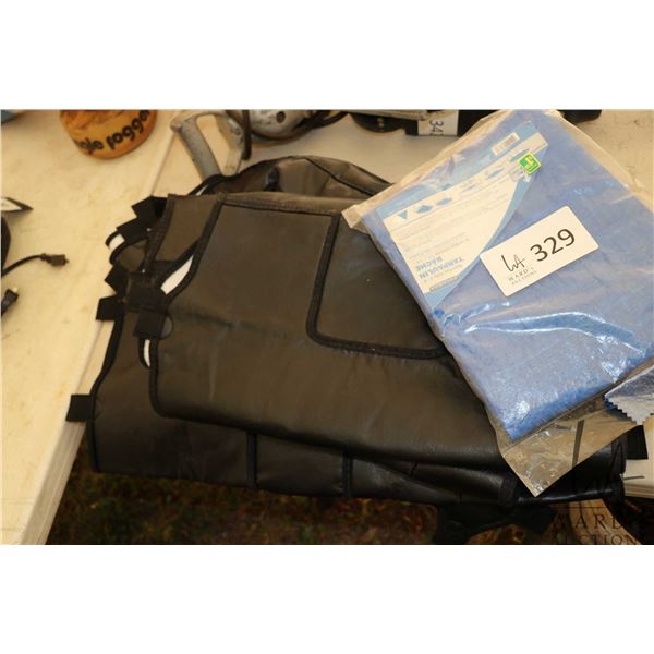 Two winter rad covers for trucks and a small tarp., all appear new