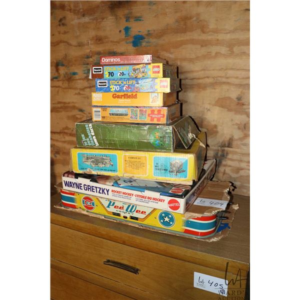 Selection of toys and games including PeeWee hockey, Wayne Gretzky rocket hockey, trains, puzzle etc
