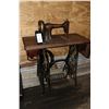 Image 1 : Antique Singer sewing machine in treadle cabinet