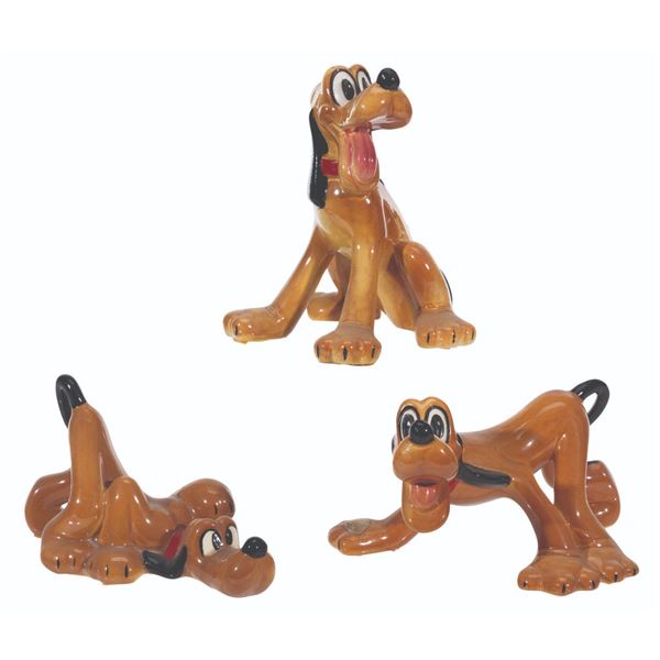 Three Evan K. Shaw Pluto Figurines.