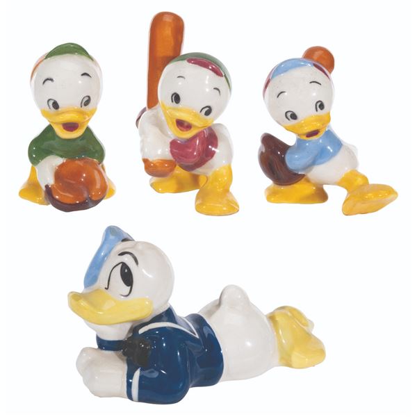 A Collection of Evan K. Shaw Donald Duck and Nephew Figurines.