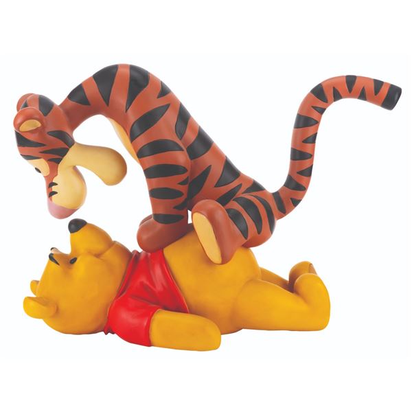 A Winnie the Pooh and Tigger Figurine.