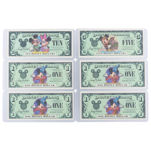 The Disneyland 2001 AA Series $1, $5, and $10 Bills.