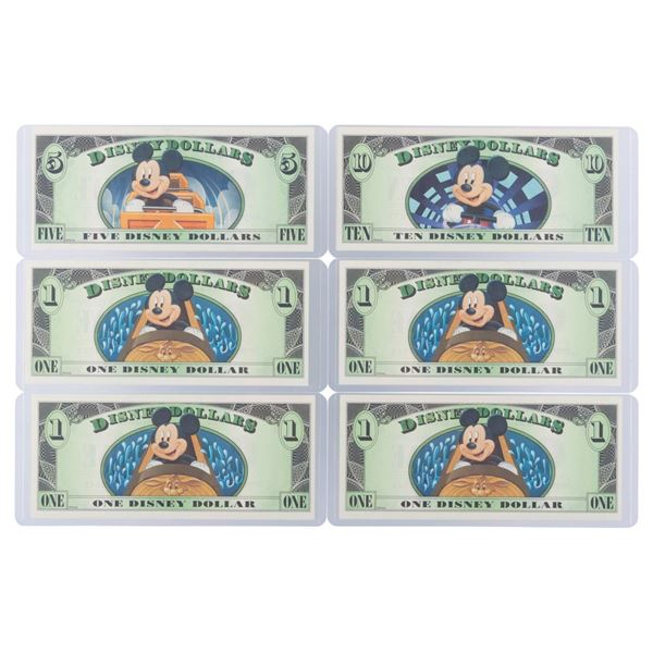 The 2014 Disney Dollars Mountains of Disney Series $1, $5, and $10 Bills.