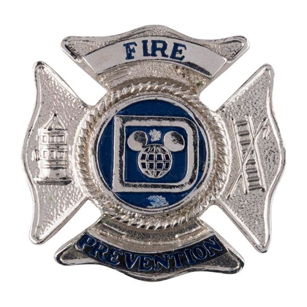 A Disney Fire Prevention Hat Badge.