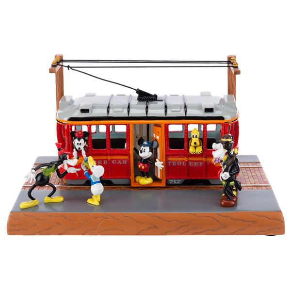 A Red Car Trolley Figurine.