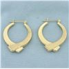 Image 1 : Crossover Ribbon Design Hoop Earrings in 14k Yellow Gold