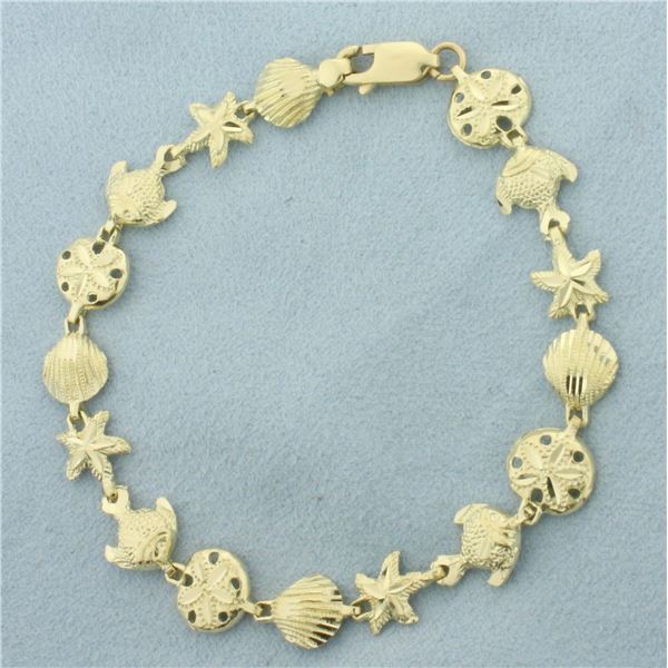 Sealife Seashell, Fish, Starfish, and Sand Dollar Bracelet in 14k Yellow Gold