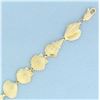 Image 2 : Seashell Bracelet in 14k Yellow Gold