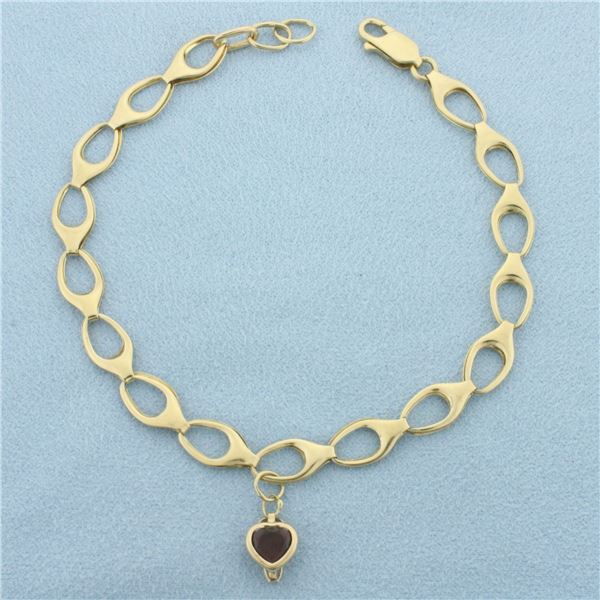 Oval Link Charm Bracelet with Garnet Charm in 10k Yellow Gold