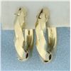Image 1 : Twisting Design Hoop Earrings in 14k Yellow Gold