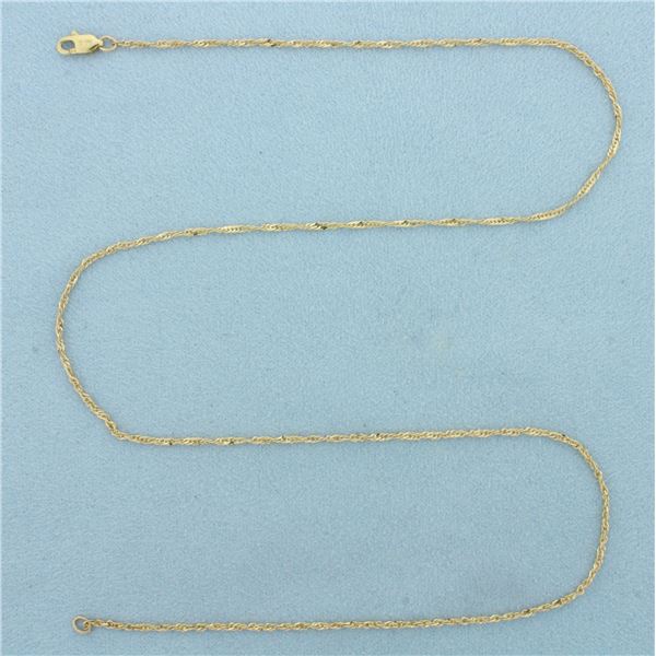 18 Inch Twisting Curb Link Chain Necklace in 14k Yellow Gold