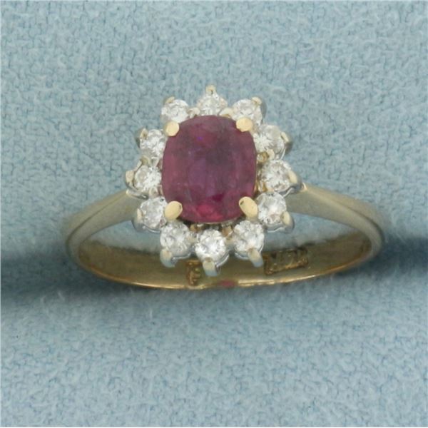 Ruby and Diamond Halo Ring in 14K Yellow Gold