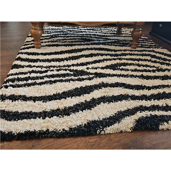 Black and White Shag Rug With Zebra Stripe Pattern
