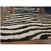 Image 1 : Black and White Shag Rug With Zebra Stripe Pattern