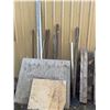 Image 1 : Scrap Lumber, Metal Poles, and Two 55-Gallon Plastic Barrels