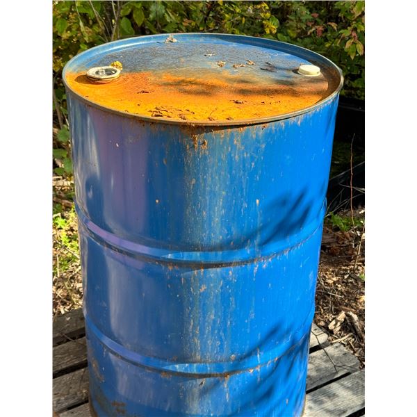 Galvanized Drum with Aged Fuel And Landscaping Roll