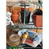 Image 2 : Greenhouse With Planters and Watering Cans