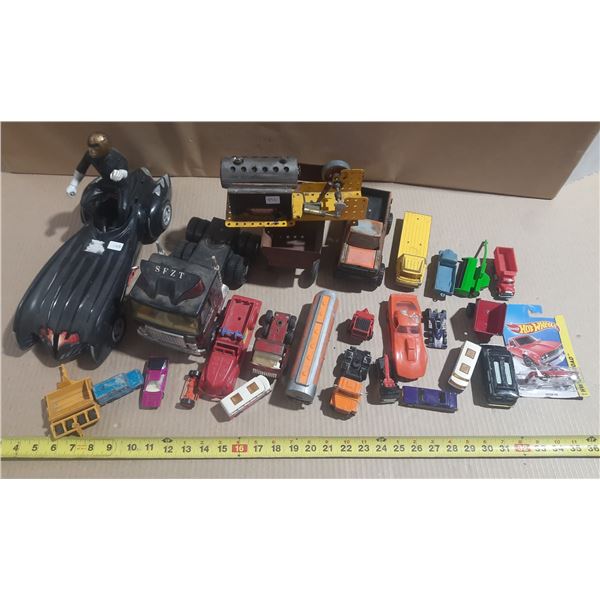 Assorted vintage and loose toys, including die-cast cars, toy trucks, a stationary steam engine, and