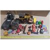 Image 1 : Assorted vintage and loose toys, including die-cast cars, toy trucks, a stationary steam engine, and