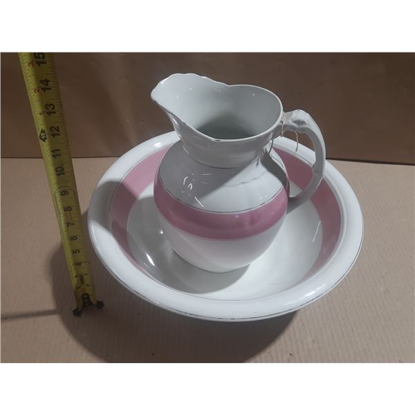 Vintage ironstone wash pitcher and basin set featuring a distinct wide pink band and a classic curve