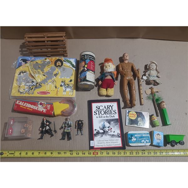 Collection of various vintage toys, books, and small collectibles.