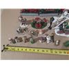 Image 2 : Collection of miniature Christmas village buildings, figurines, a train set, and a "Village Skating 