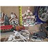 Image 7 : Collection of miniature Christmas village buildings, figurines, a train set, and a "Village Skating 