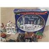 Image 8 : Collection of miniature Christmas village buildings, figurines, a train set, and a "Village Skating 