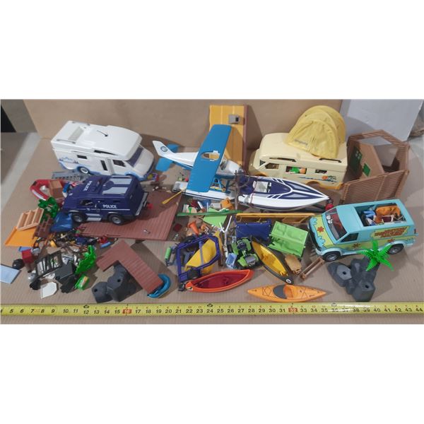 Large lot of assorted PLAYMOBIL toys, including several prominent vehicle and cabin sets, etc.