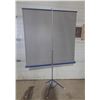 Image 3 : Vintage Da-Lite Flyer portable tripod projector screen with a blue metal housing. (Total Height with