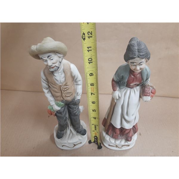Vintage bisque porcelain farmer and wife figurines, commonly produced by brands like Homco (Home Int