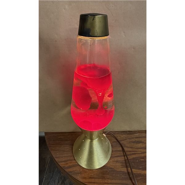 Vintage Lava Lite Starlight / Century lava lamp featuring a gold-finished starburst base and cap wit