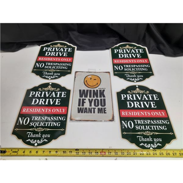 (4) "Private Drive" security signs alongside a retro novelty sign featuring a winking smiley face. (