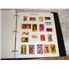 Image 3 : Binder of 20 Pages Of Stamps Arranged By Theme  Military, Sports, Music, Christmas, Animals, Flowers