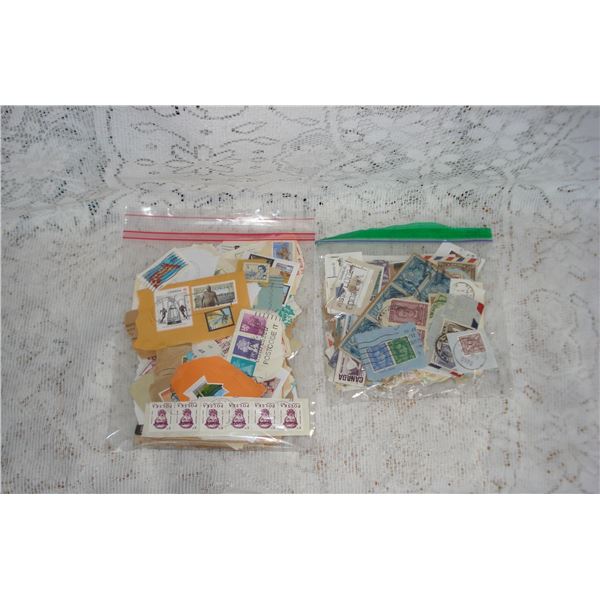 2 Bags Of Stamps On Paper