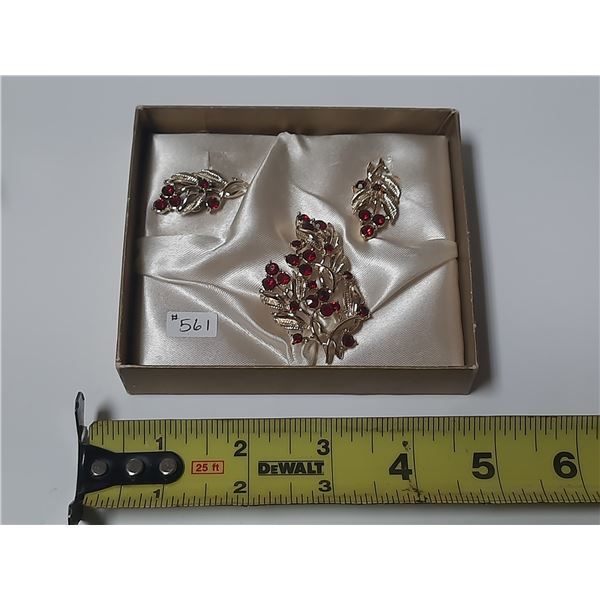 Gold tone broach and earring set, red stones