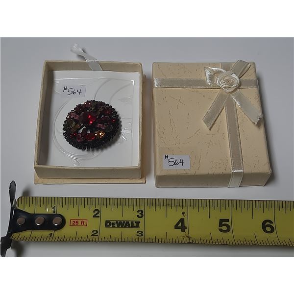 Jappaned rhinestone broach