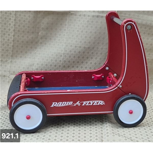 Child's push-type Radio Flyer red wagon, has slots to add sides to it