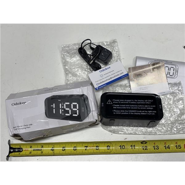 Odokee Digital Dual Alarm Clock featuring a black rectangular body with large white LED digits and a