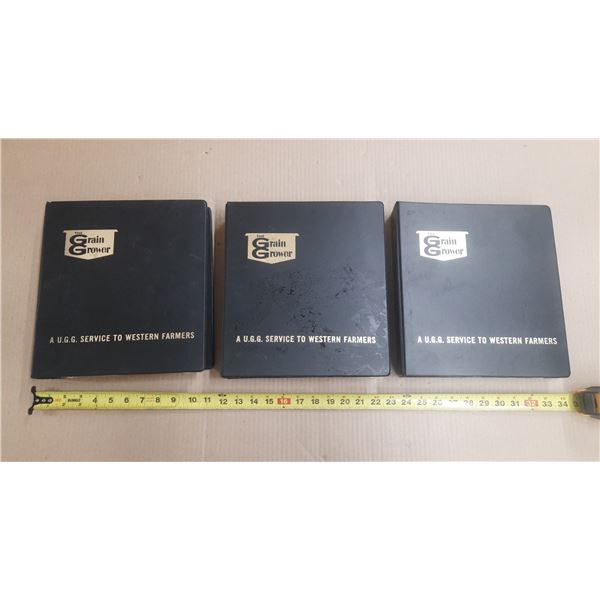 (3) Vintage black books labeled "The Grain Grower - A U.G.G. Service to Western Farmers" (United Gra