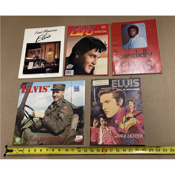 Collection of vintage Elvis Presley publications, including photo magazines, a calendar, and a book.