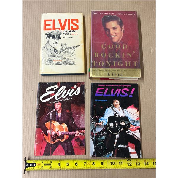 Collection of vintage Elvis Presley memorabilia featuring books and a calendar.