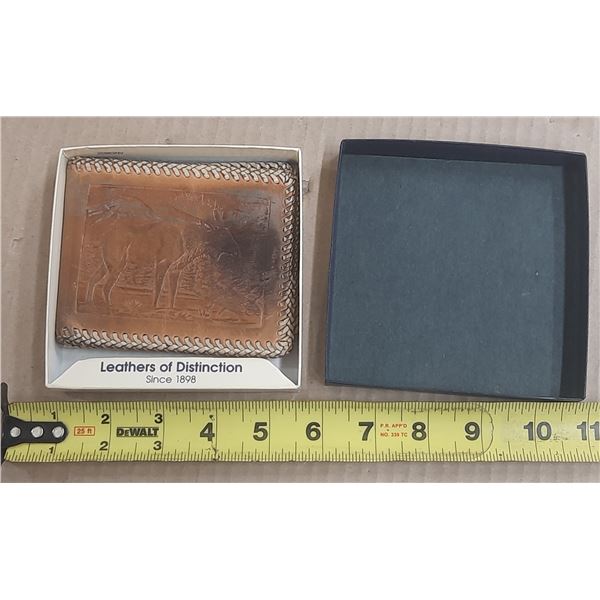 Vintage, brown hand-tooled leather bifold wallet featuring an embossed bull or moose wildlife design