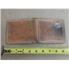 Image 4 : Vintage, brown hand-tooled leather bifold wallet featuring an embossed bull or moose wildlife design