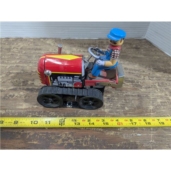 Vintage wind up toy tractor