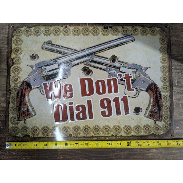 Tin sign, 16.5x12, "we don’t dial 911"