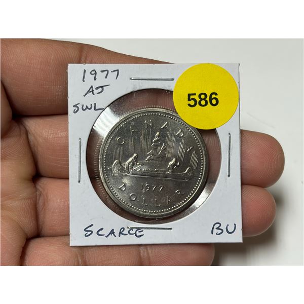 1977 Attached Jewel Short Water Line Nickel Dollar. Scarce. BU.